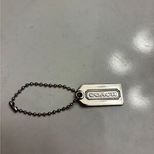 Coach small silver tone key hang tag